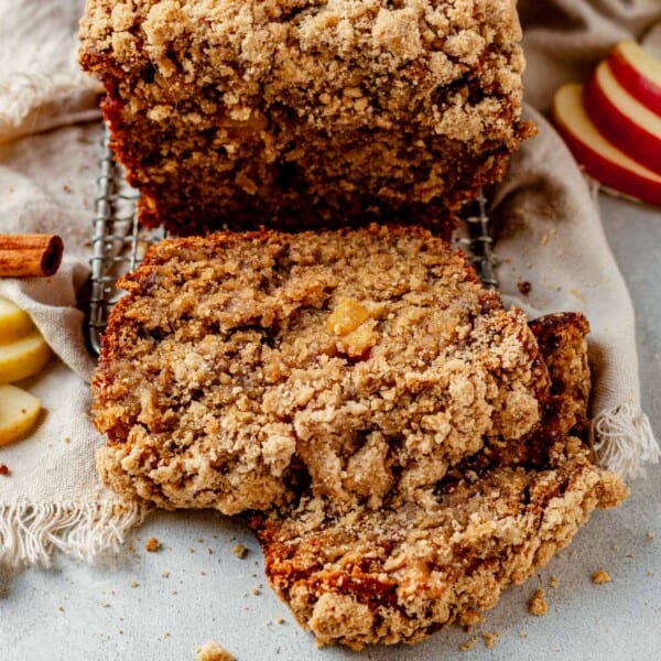 two slices of apple banana bread on a wire rack