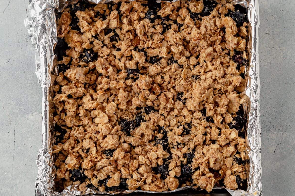 crumb topping on top of blueberry filling before baking