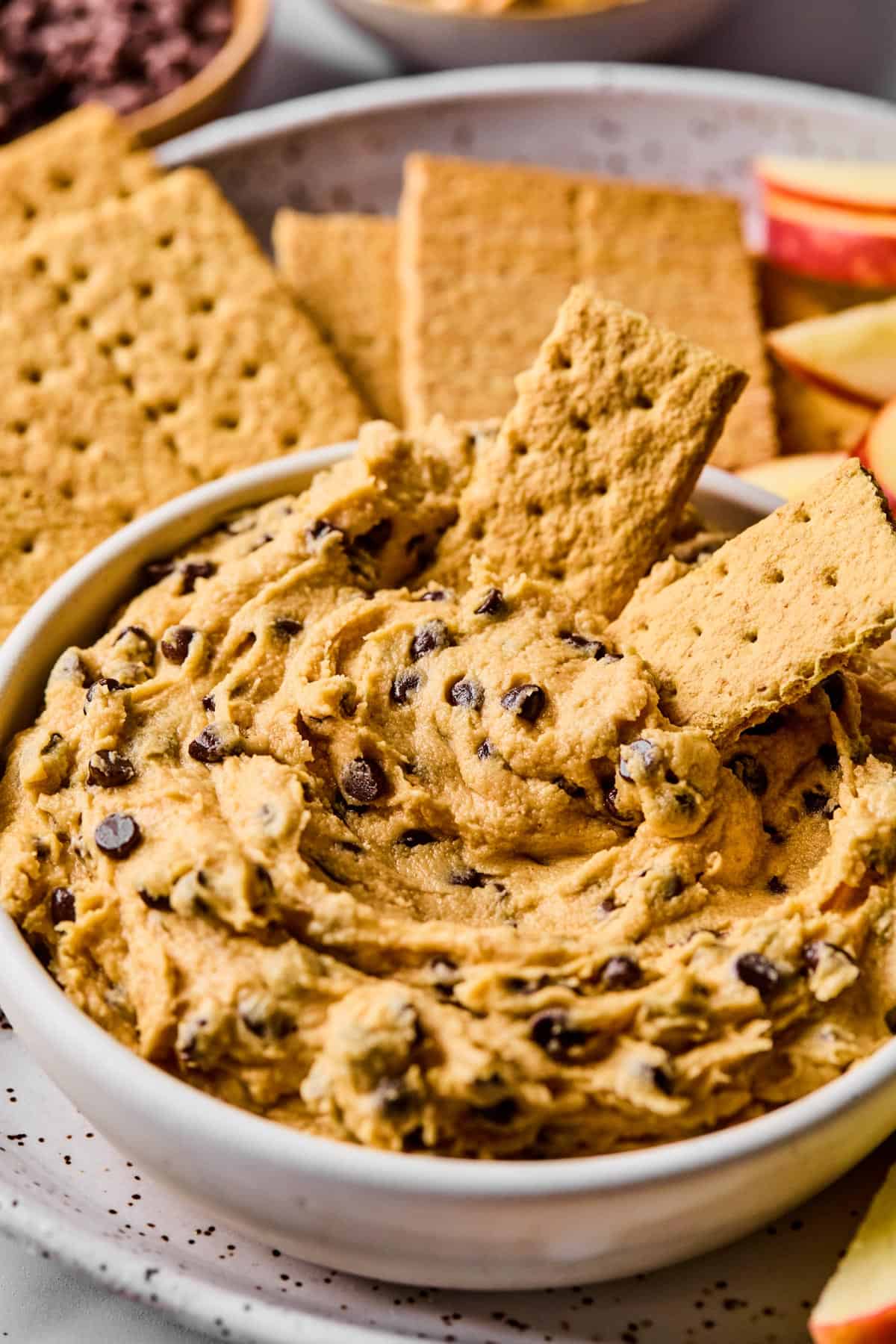buckeye dip in a bowl served with graham cracker sheets