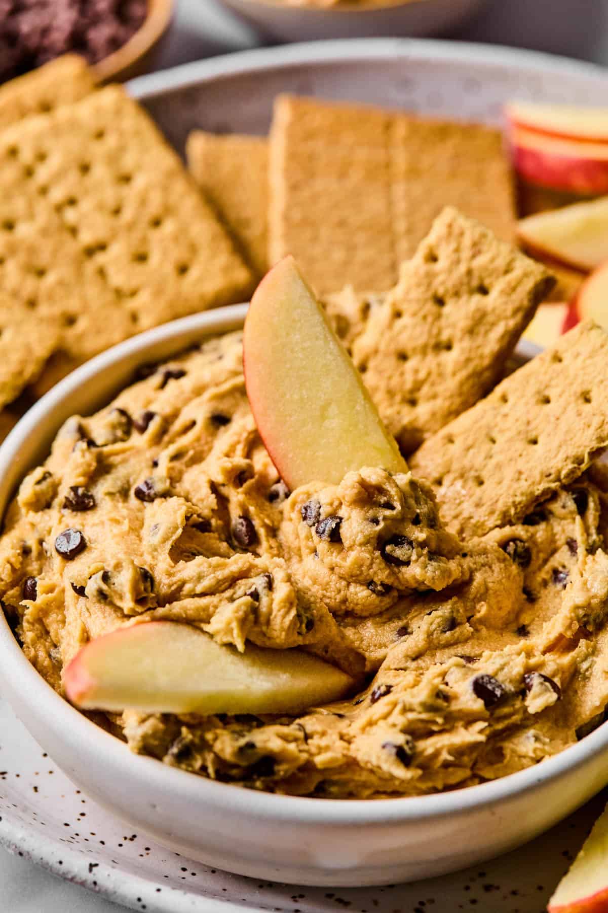 graham crackers and apple slices served with buckeye dip