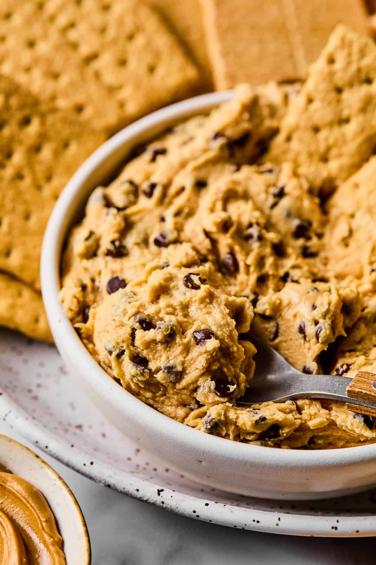 spoon scooping into a bowl of buckeye dip
