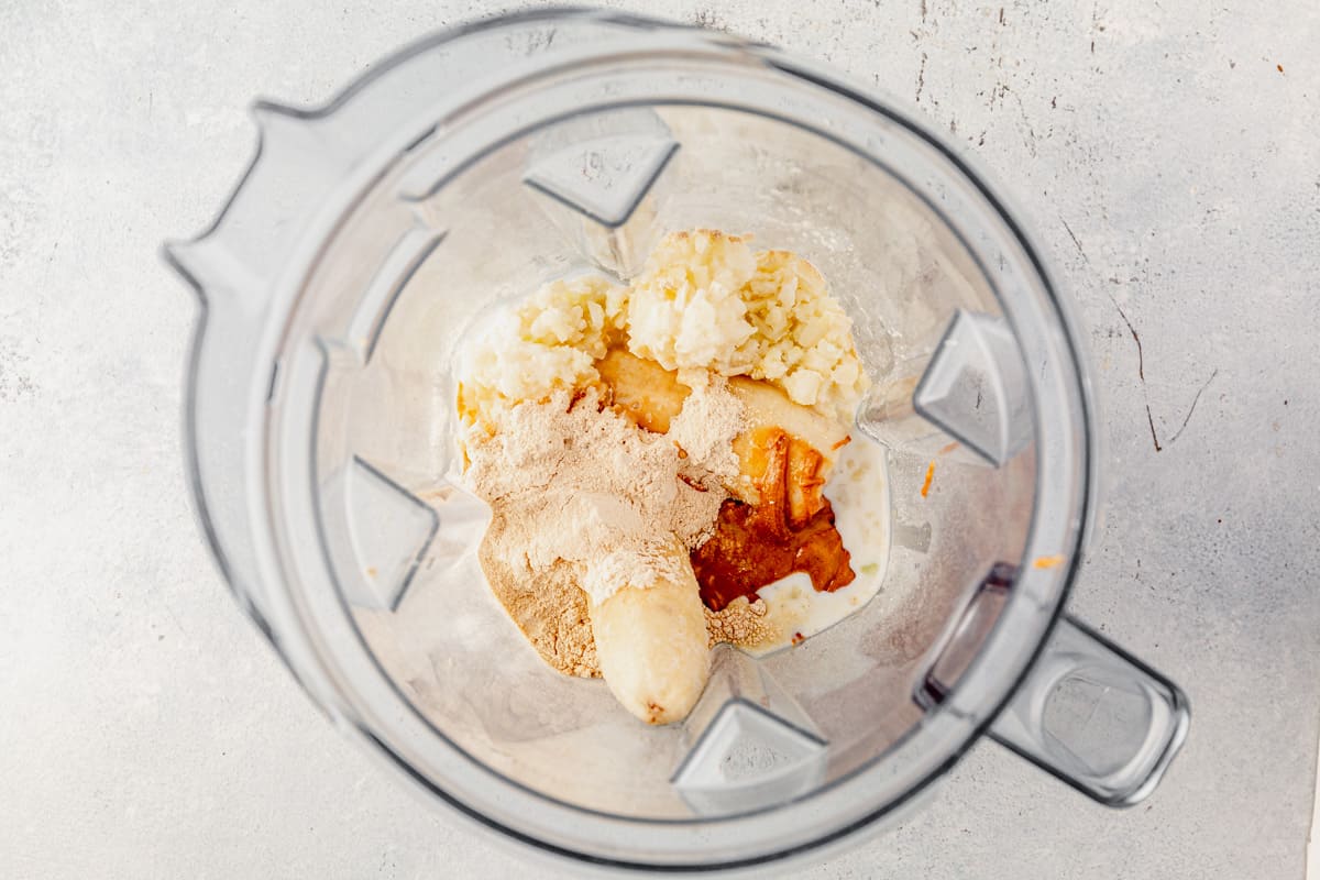 bananas, protein powder, milk, and almond extract in a blender