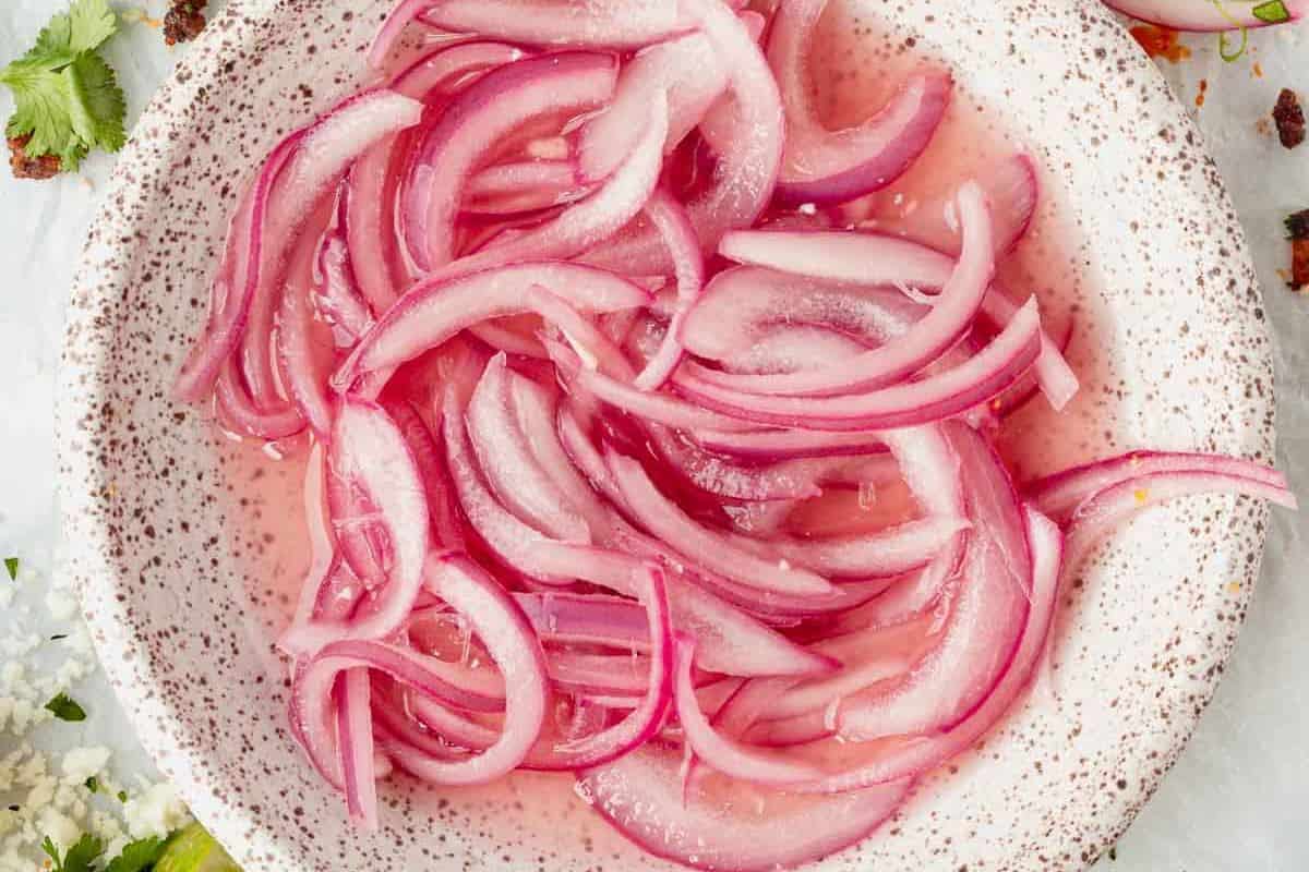 pickled red onions in a dish