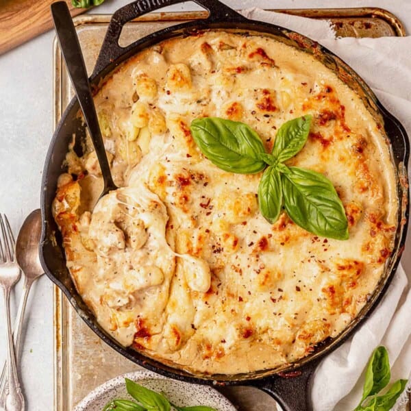 chicken alfredo gnocchi bake in a skillet