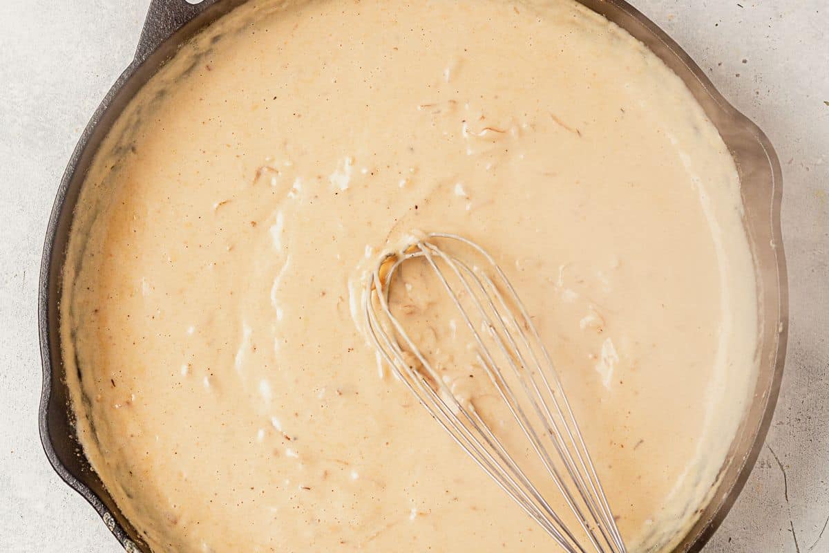 homemade alfredo sauce in a skillet