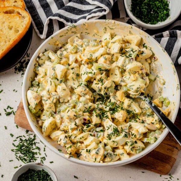 cottage cheese egg salad in a bowl with fresh herbs on top.