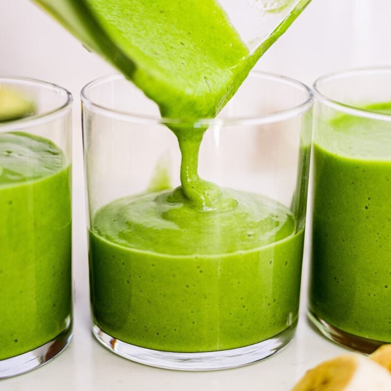 avocado smoothie pouring into a glass