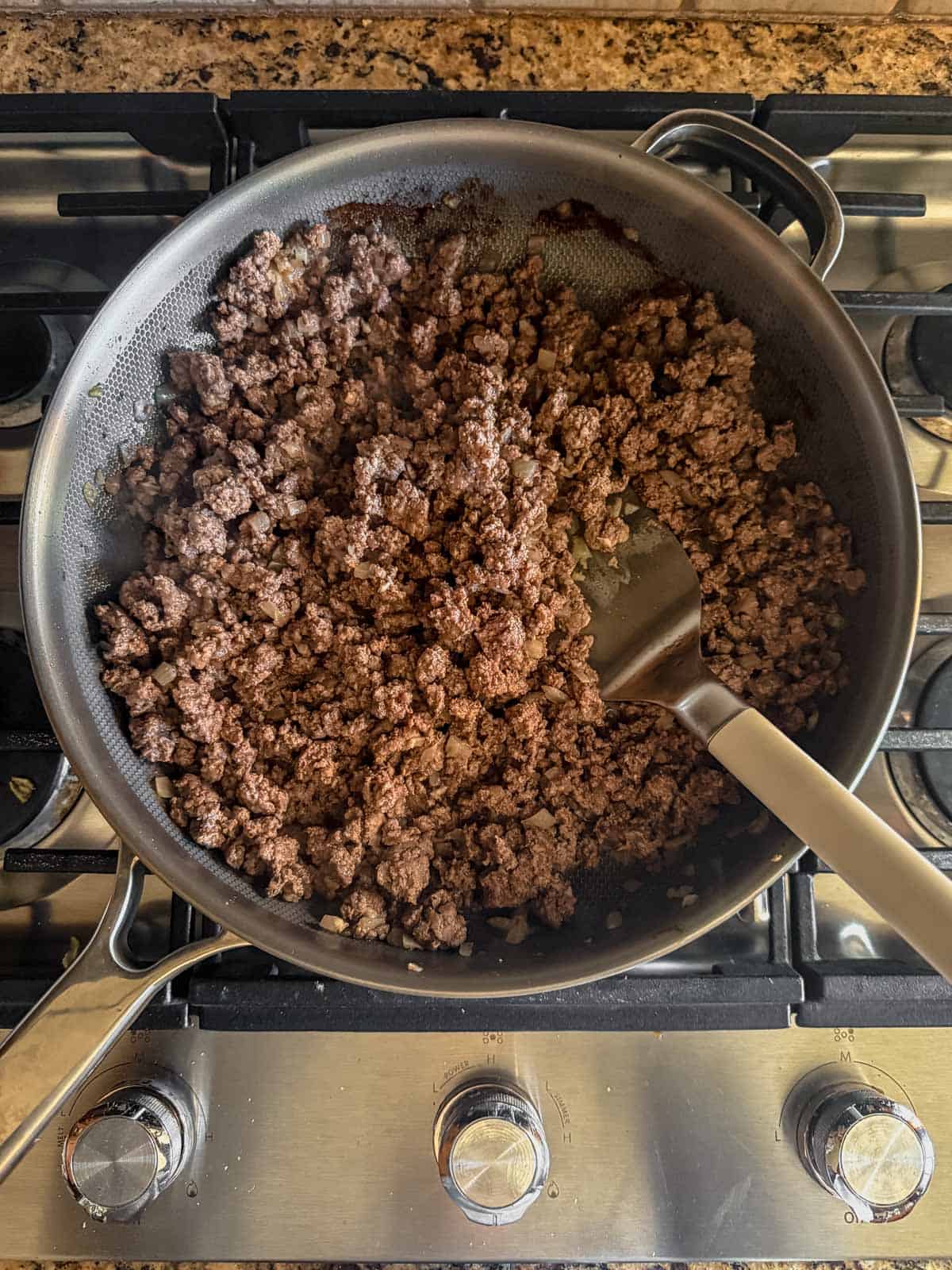 ground beef and onion browned in a skillet.