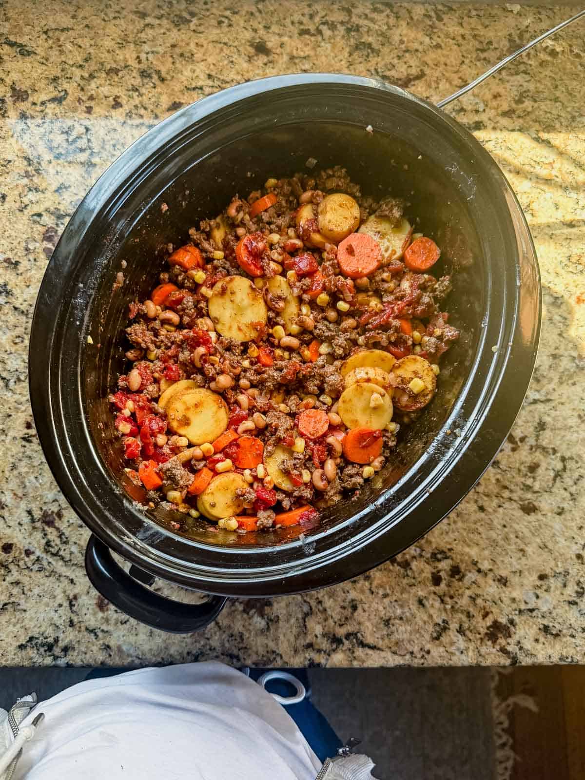cowboy casserole cooking in a slow cooker.