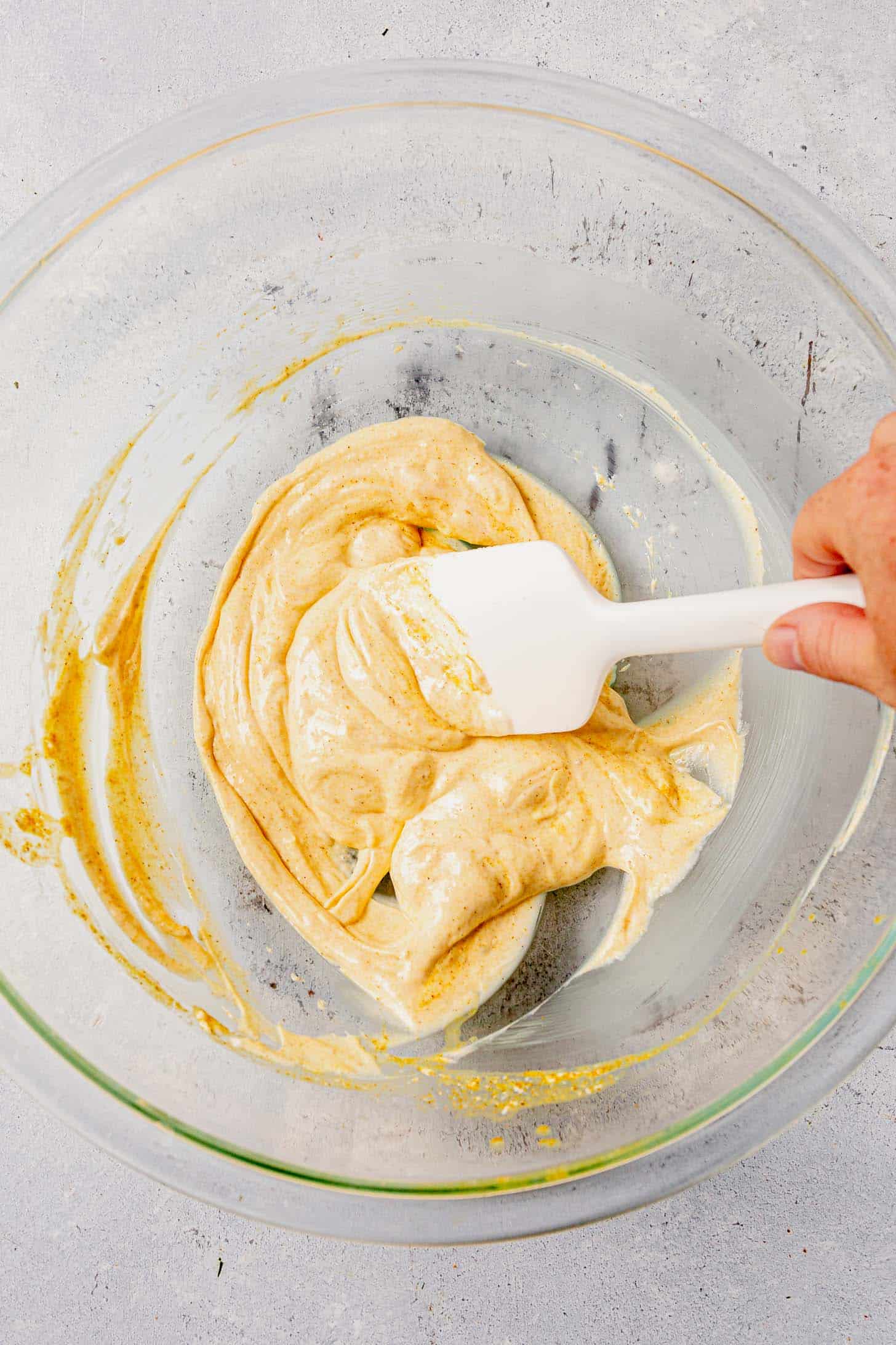 stirring together mayo, curry powder, and lime juice in a large bowl