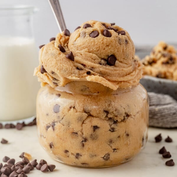 edible cookie dough in a glass jar with a spoon