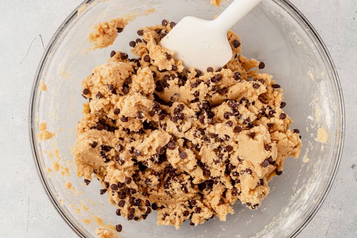 edible chocolate chip cookie dough in a glass mixing bowl