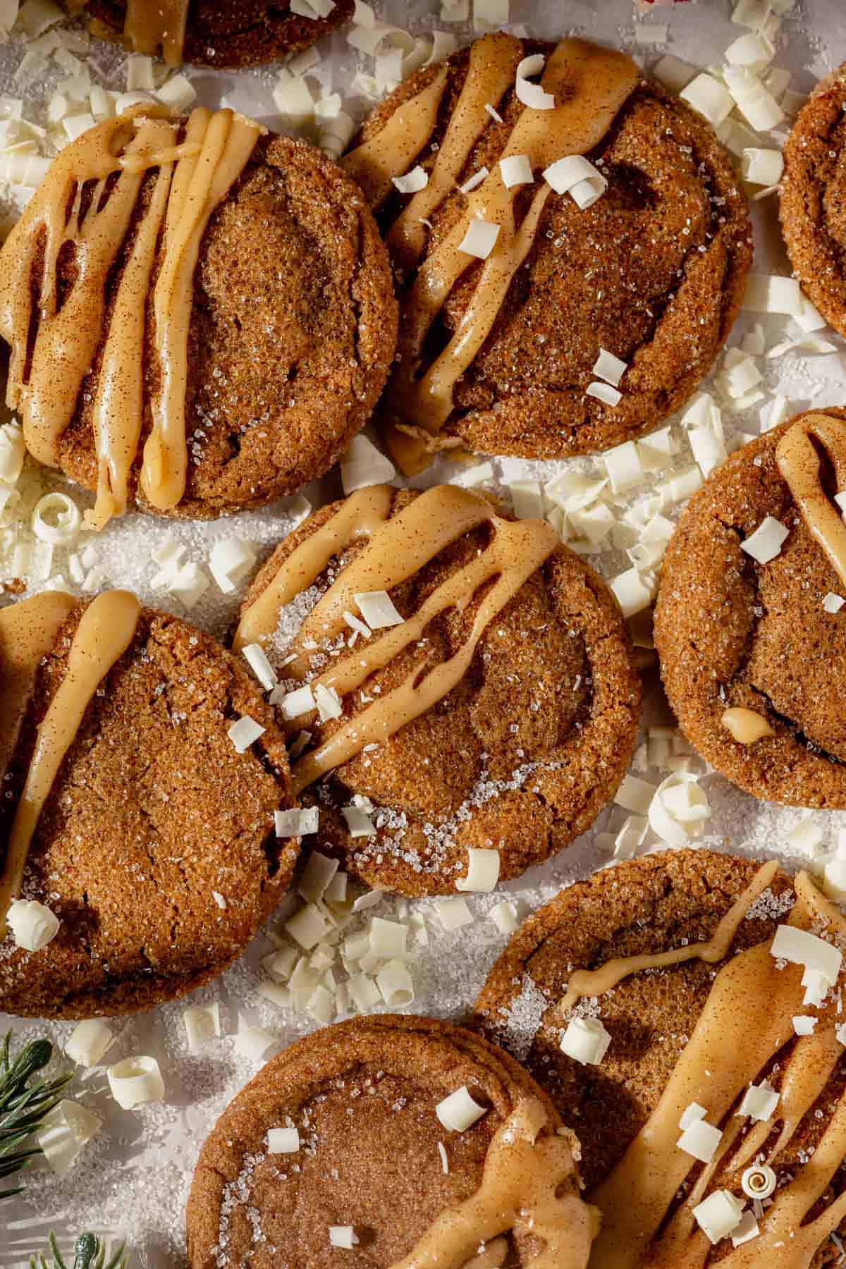 iced gingerbread latte cookies surrounded by white chocolate curls.