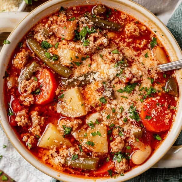 ground turkey soup with veggies and topped with parmesan and parsley