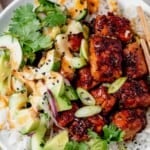 honey garlic salmon rice bowl with chop sticks resting on it