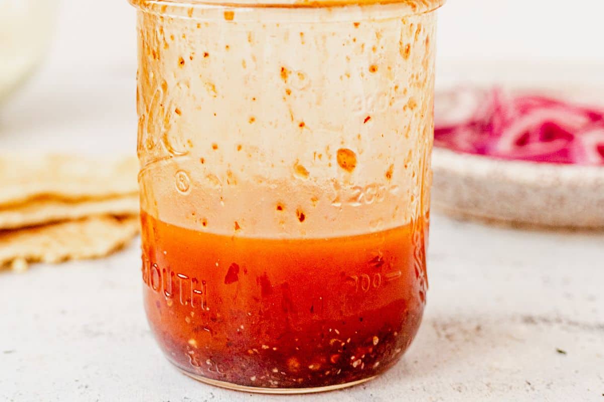 harissa vinaigrette in a mason jar