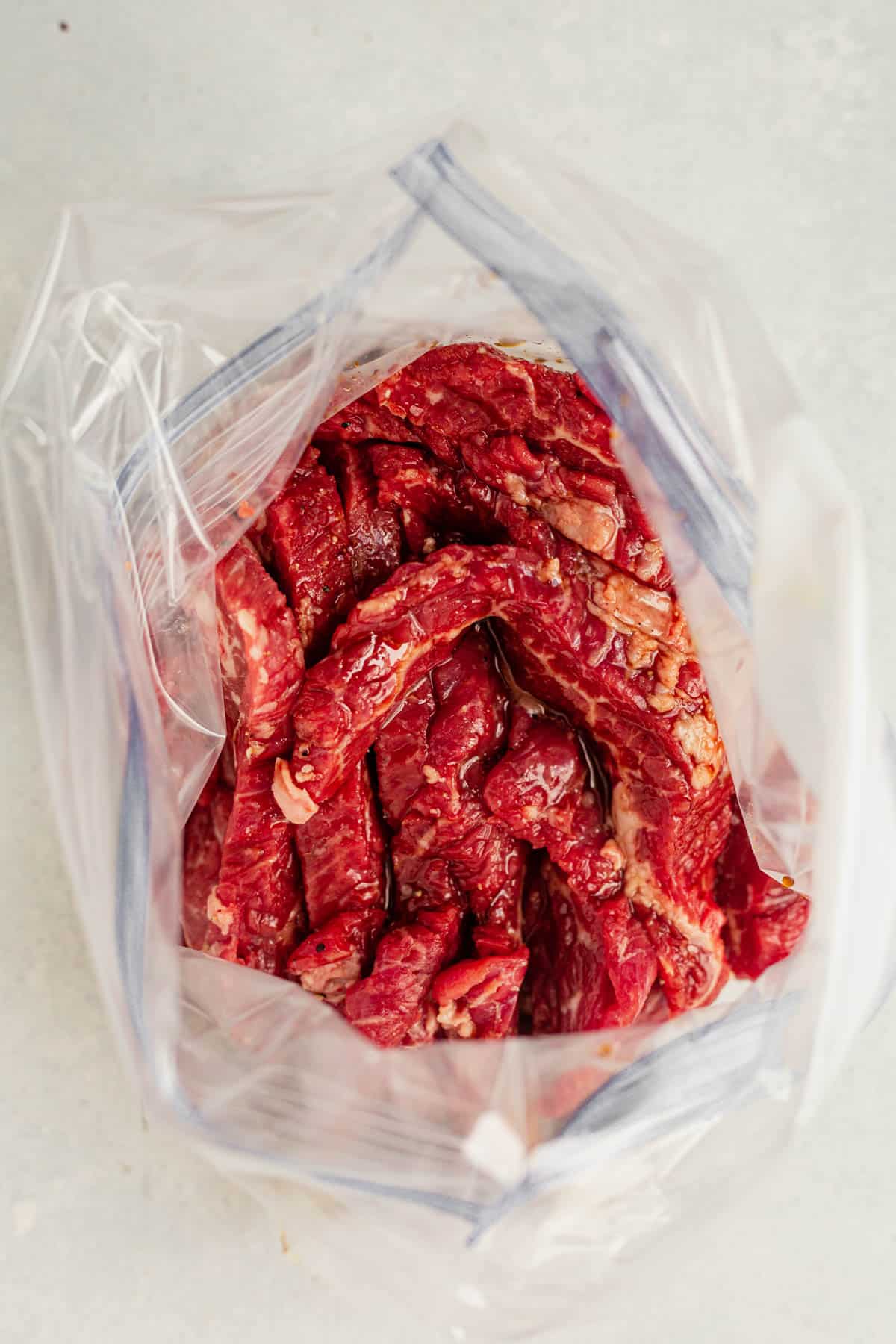 marinated flank steak in a freezer bag