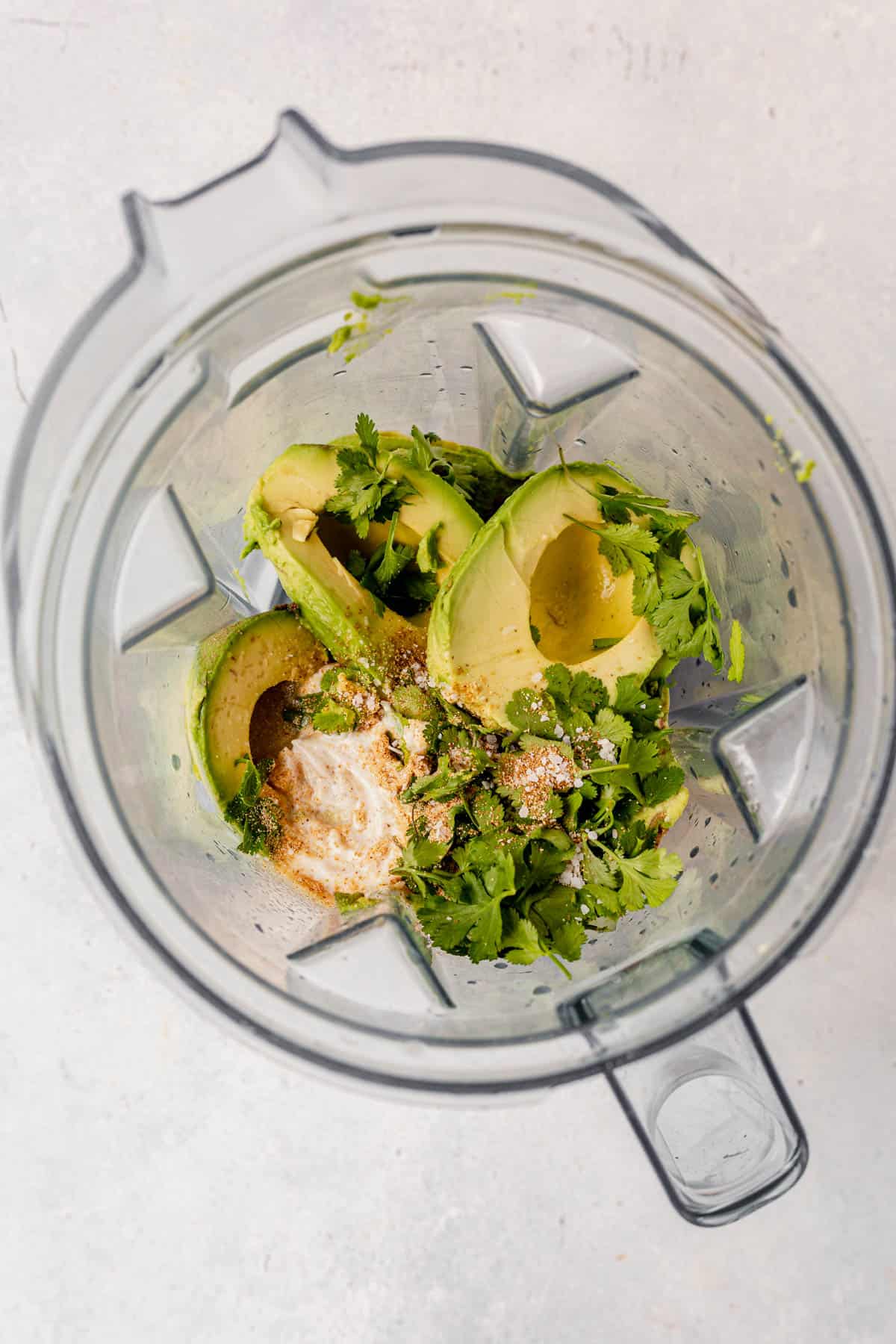 avocado dip ingredients in a blender