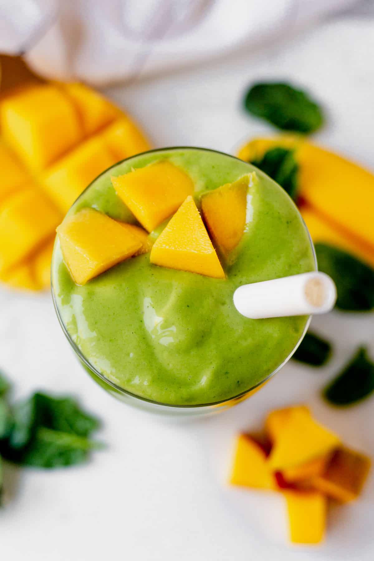 the top of a creamy spinach mango smoothie