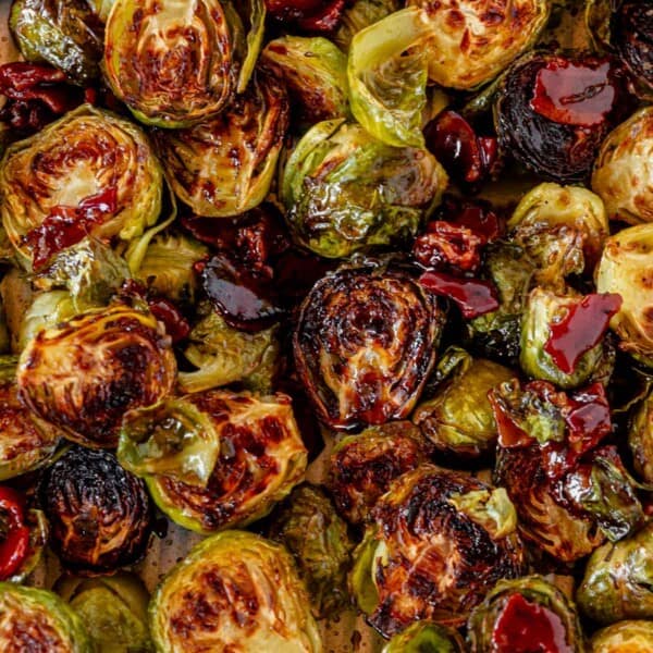 crispy maple bacon brussel sprouts on a sheet pan.