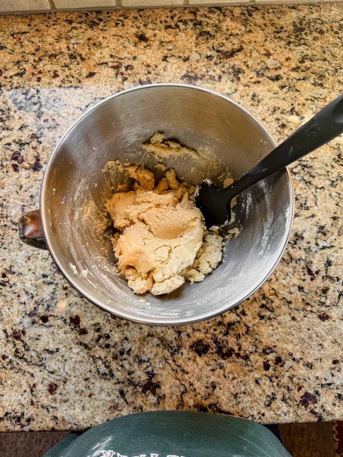 christmas sugar cookie dough mixed in a bowl.