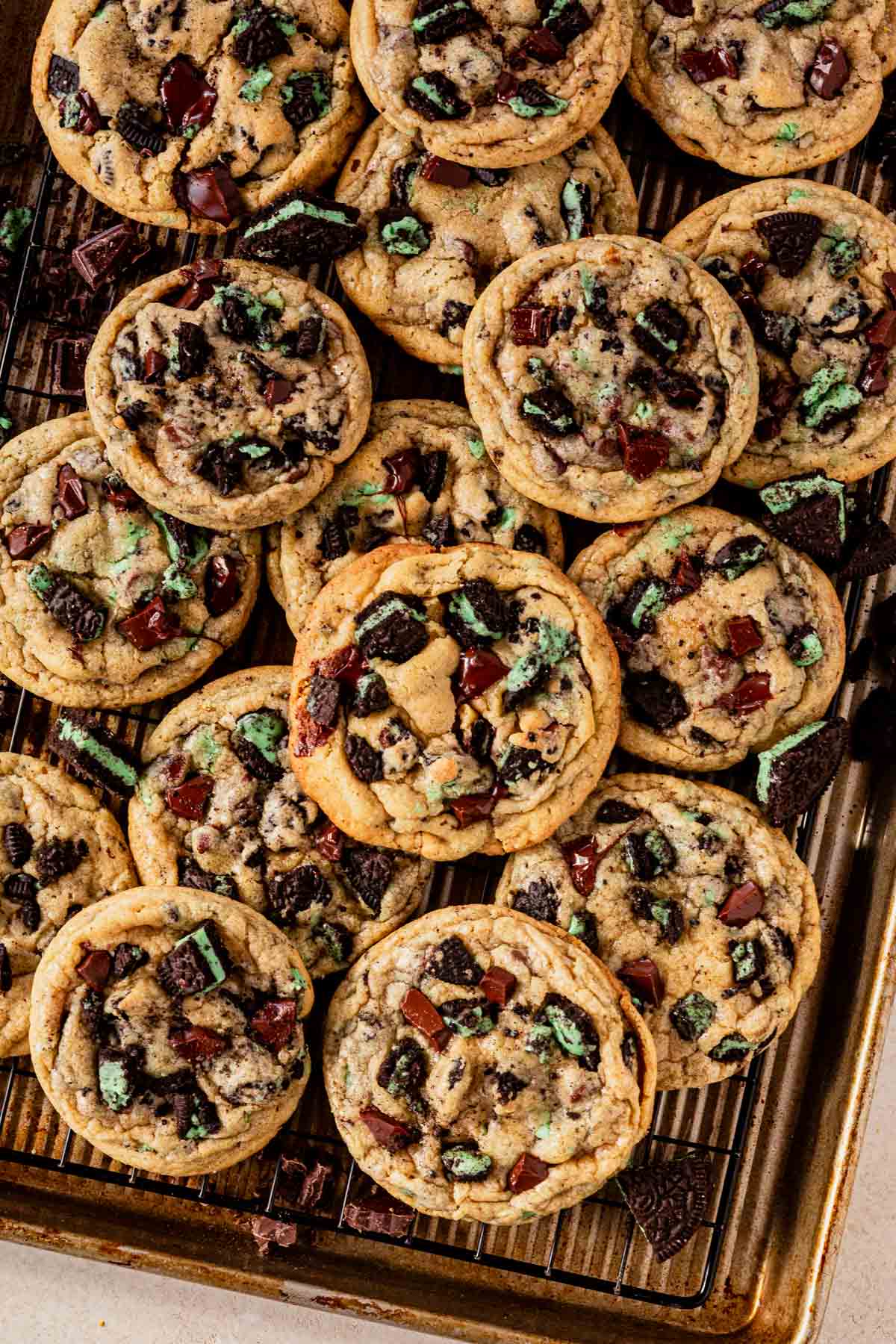 a batch of mint oreo cookies on a cookie sheet.
