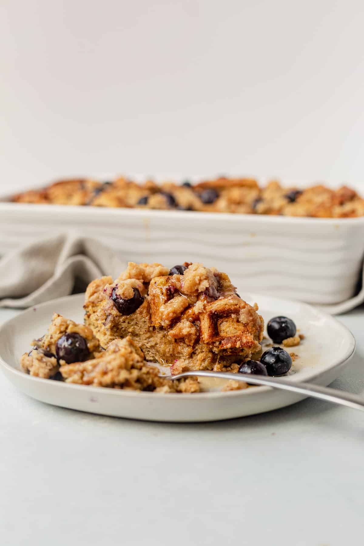 a bite taken out of blueberry waffle casserole