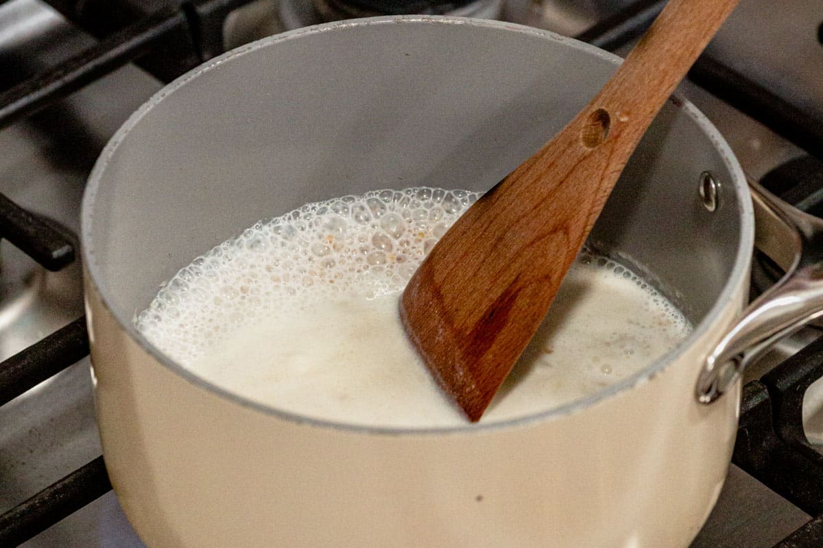 Simmering milk, water, and steel cut oats on the stove for overnight oats.