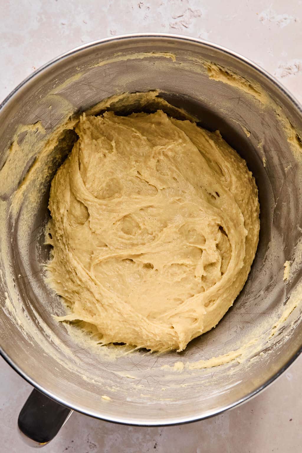 cinnamon roll dough in a stand mixer after kneading.