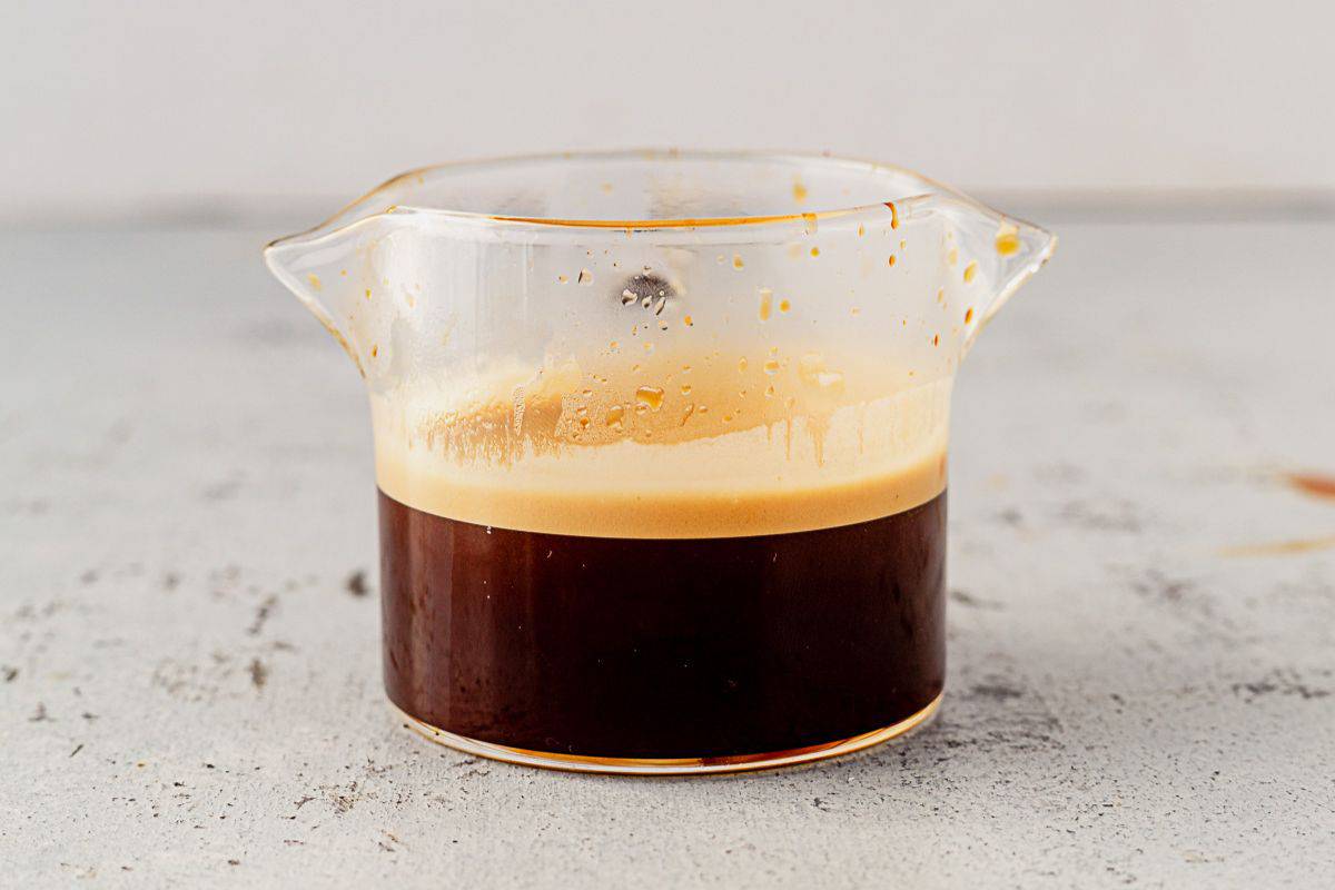 a double shot of espresso in an espresso shot glass.