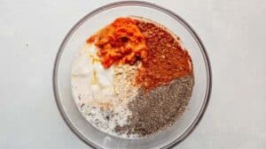 pumpkin overnight oats ingredients in a large glass bowl