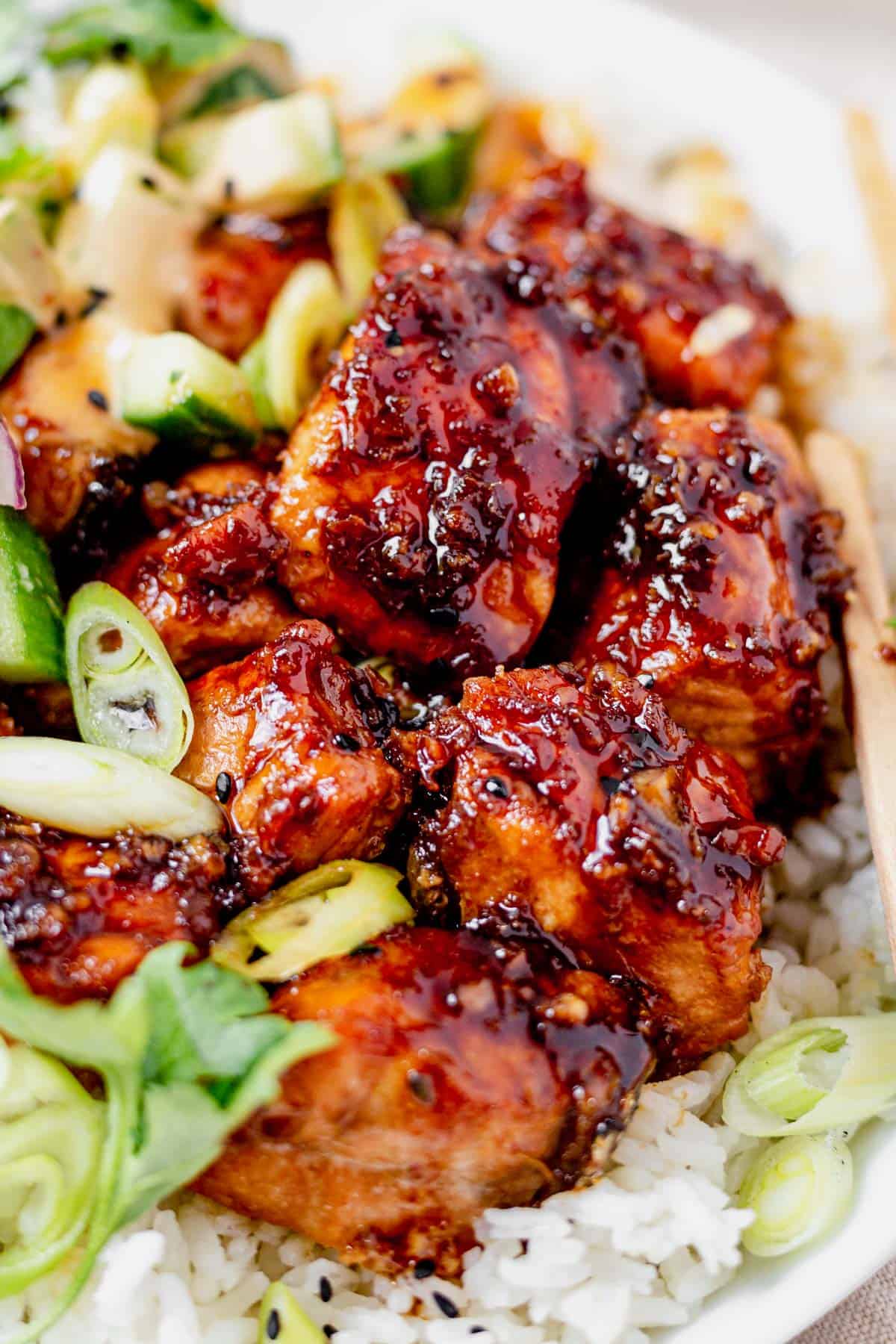 salmon covered in honey garlic sauce on top of rice