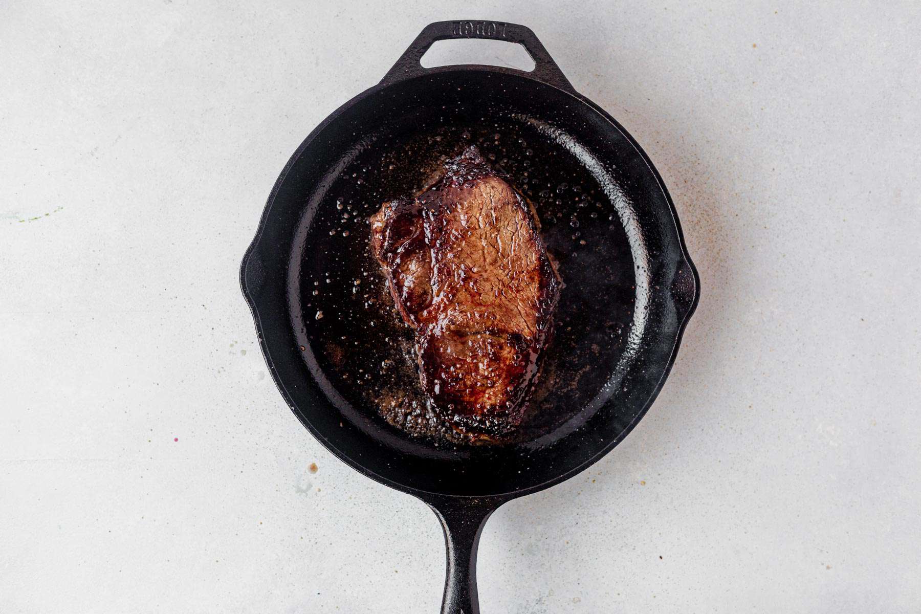 seared steak in a skillet