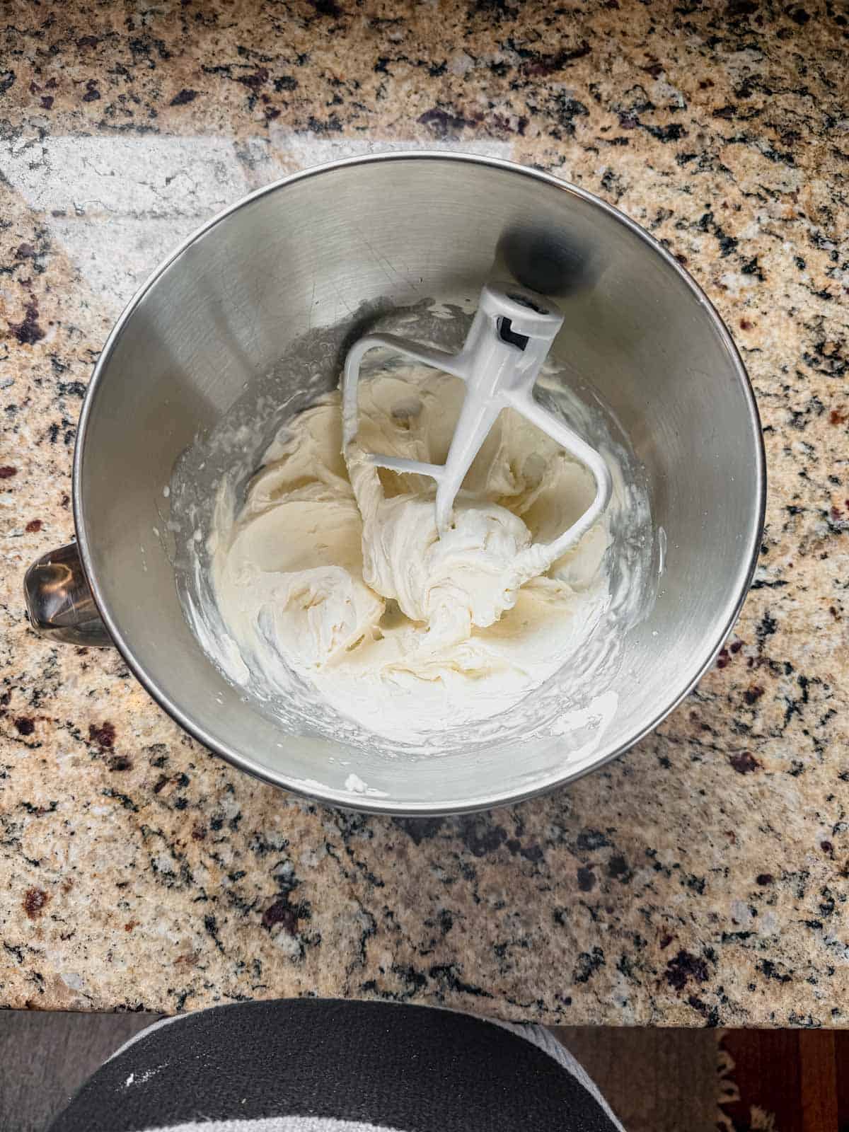whipped cream cheese in a stand mixer bowl.