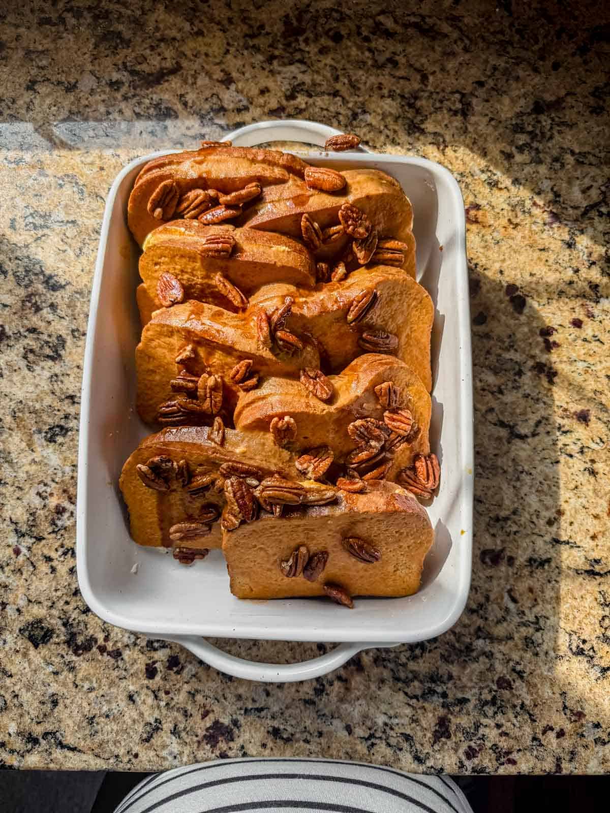baked pumpkin stuffed french toast on a counter after baking.