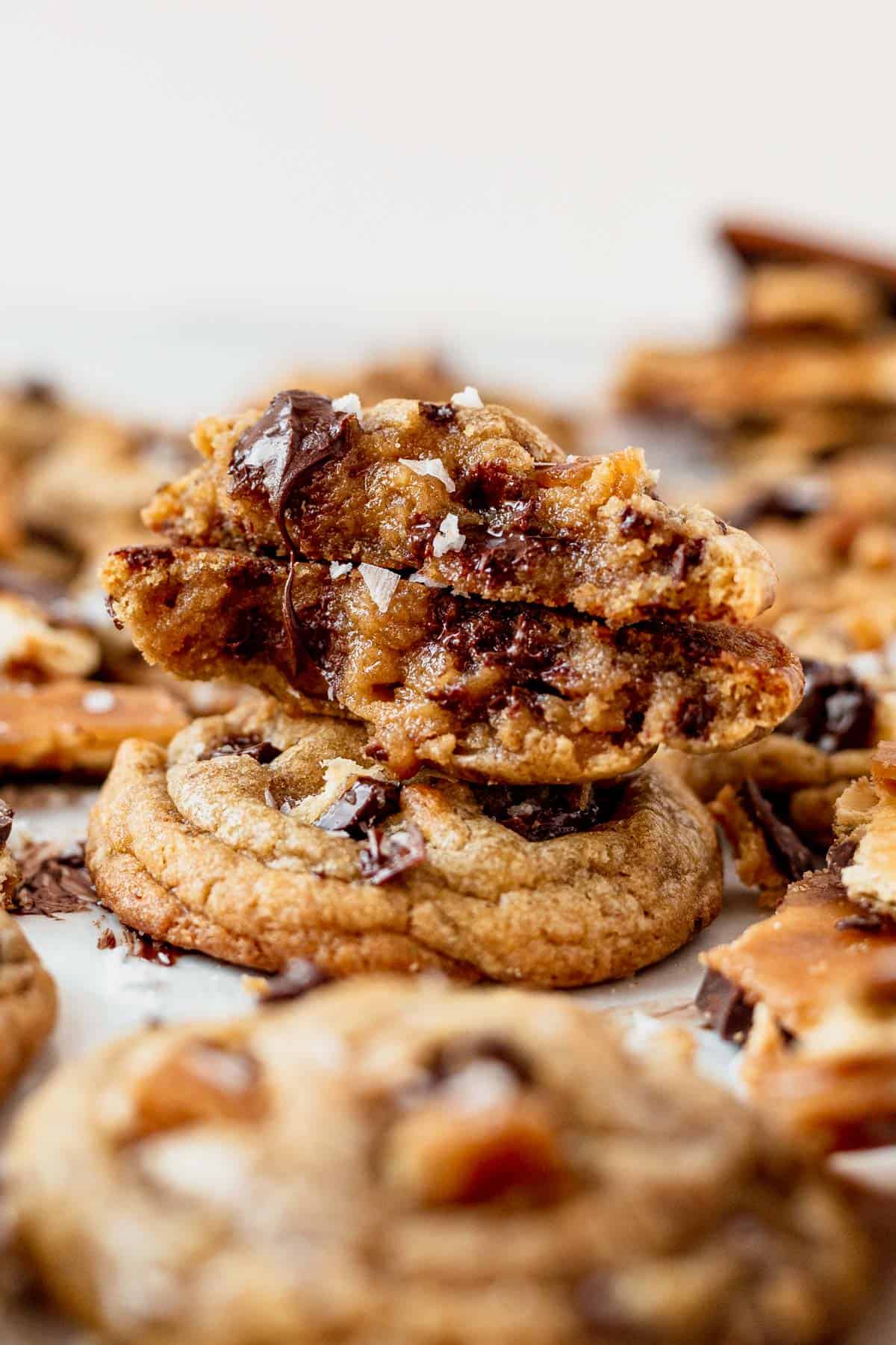 a toffee cookie broken in half to see the melted chocolate inside