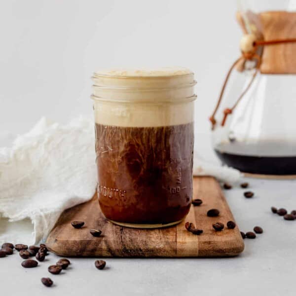 cold brew coffee in a mason jar topped with vanilla sweet cream cold foam