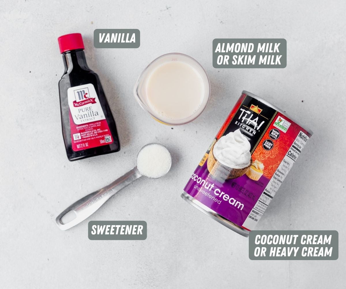 vanilla, sugar, milk and cream measured out on a table